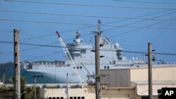 FS Mistral, a French amphibious assault ship, pulls into port at Naval Base Guam, May 11, 2017, near Hagatna, Guam. Troops from the United States, Japan, France and the United Kingdom are gathering for drills they say will show support for the free passage of vessels in international waters.