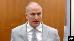 FILE - Former Minneapolis police Officer Derek Chauvin addresses the court as Hennepin County Judge Peter Cahill presides over Chauvin's sentencing at the Hennepin County Courthouse in Minneapolis June 25, 2021.
