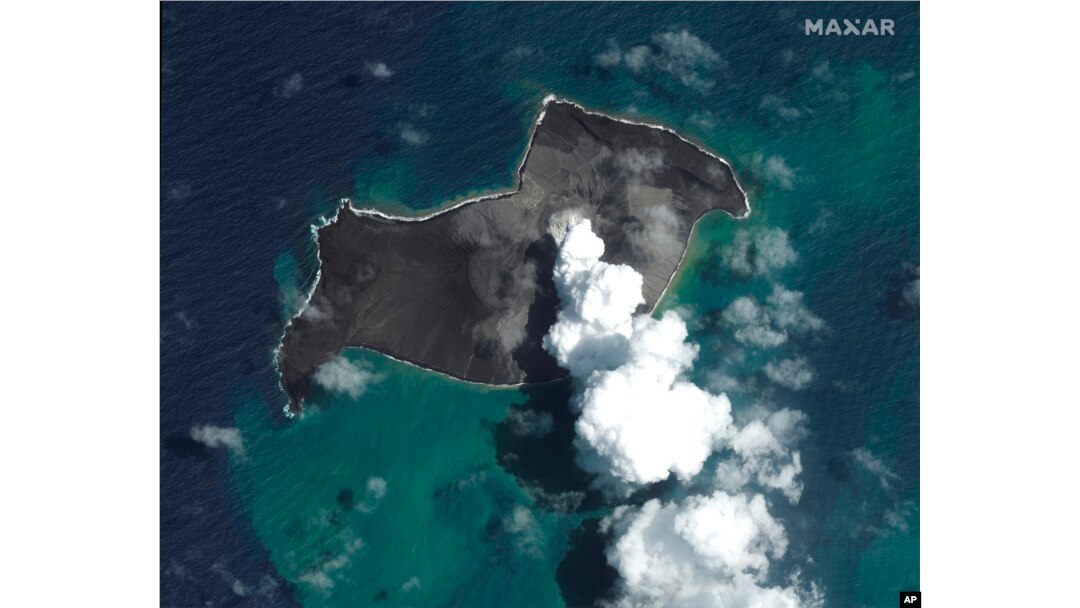 FILE - This satellite image provided by Maxar Technologies shows an overview of Hunga Tonga Hunga Ha'apai volcano in Tonga on Jan. 6, 2022, before a huge undersea volcanic eruption.
