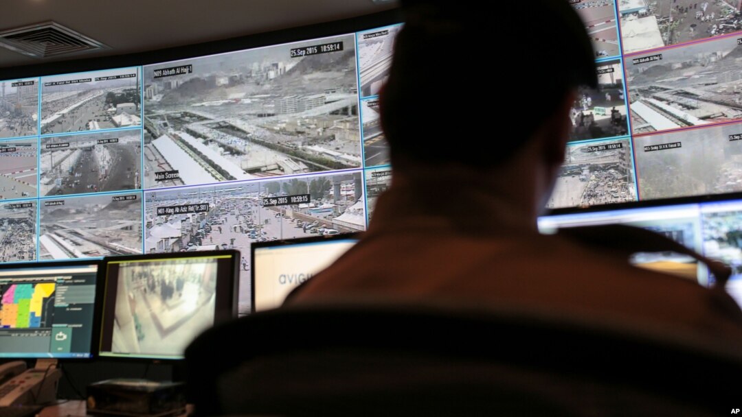 FILE - A security officer monitors Muslim pilgrims attending the annual hajj pilgrimage on CCTV screens at a security command center in Mina, Saudi Arabia, a day after a stampede killed more than 700 people, Sept. 25 2015. 