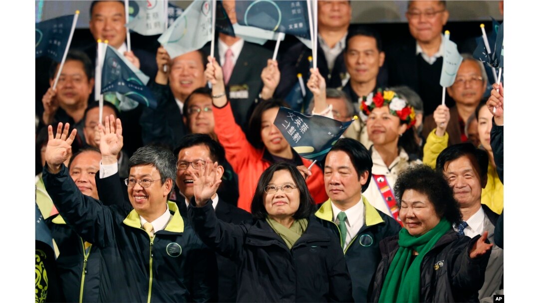 Taiwan's Democratic Progressive Party, DPP, presidential candidate, Tsai Ing-wen, waves as she declares victory in the presidential election in Taipei, Taiwan, Jan. 16, 2016.