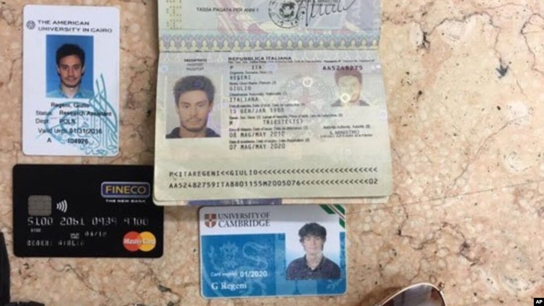 In this photo released by the Egyptian Ministry of Interior on Thursday, Mar. 24, 2016, personal belongings of slain Italian graduate student Giulio Regeni, including his passport, are displayed.