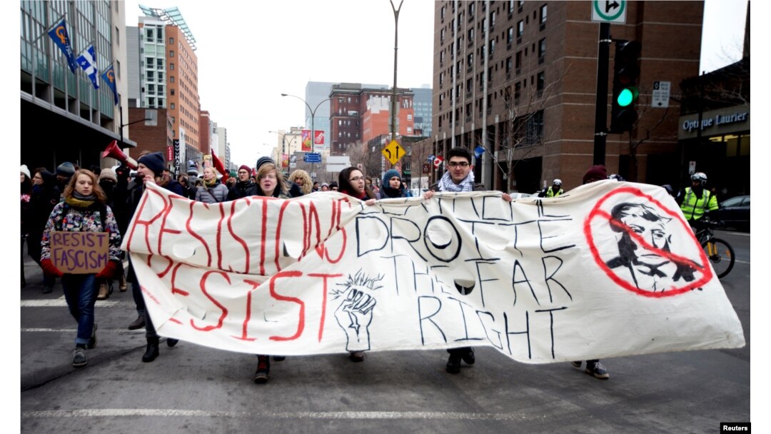 Protesters march against U.S. President Donald Trump in downtown Montreal, Canada, Jan. 20, 2017.