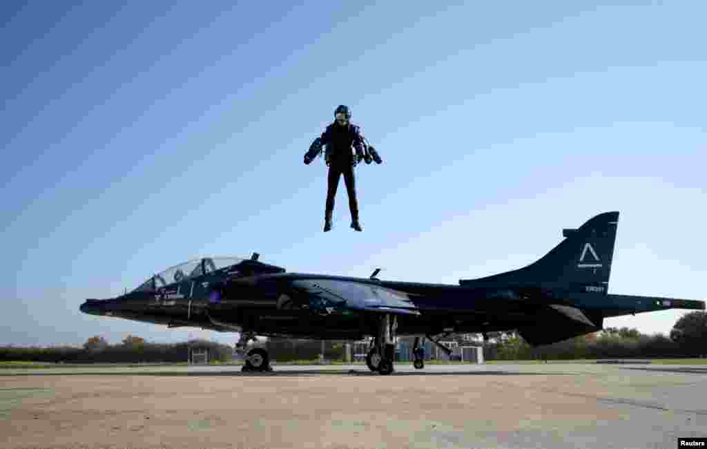 In this October 4 photo, Richard Browning, Chief Test Pilot and CEO of Gravity Industries, wears a Jet Suit and flies during a demonstration flight at Bentwaters Park, Woodbridge, Britain.