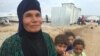 Mariam Hassan, grandmother of 17, ran through a valley for hours, fleeing IS sniper fire, mortars, airstrikes and helicopter fire in western Mosul on March 20, 2017 at the Chamakor camp in the Kurdistan region of Iraq. (H.Murdock/VOA)
