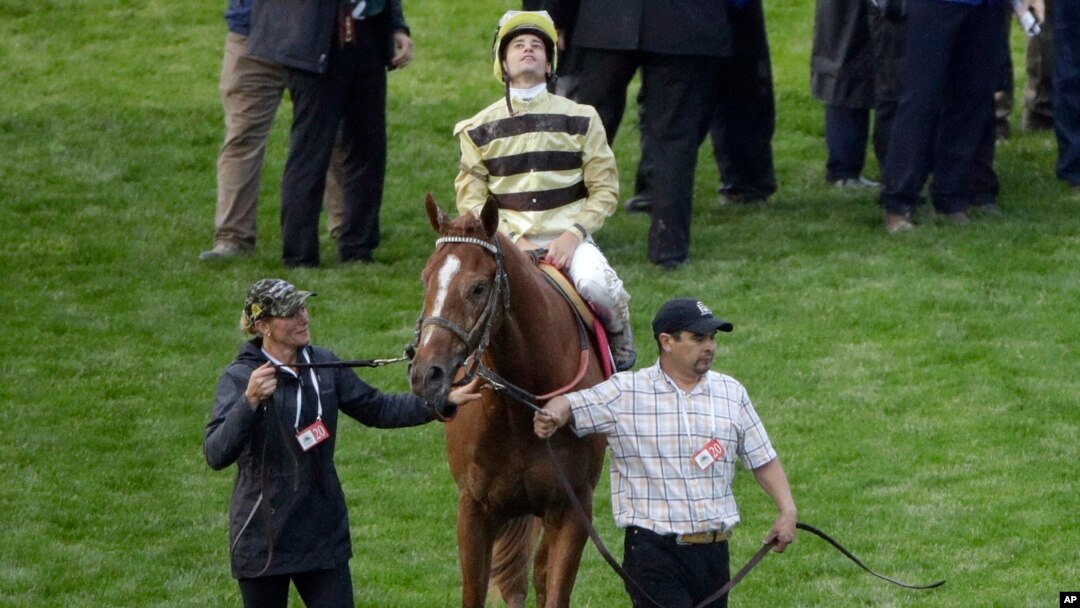 FILE - Flavien Prat on Country House reacts after the 145th running of the Kentucky Derby horse race at Churchill Downs in Louisville, Ky., May 4, 2019.