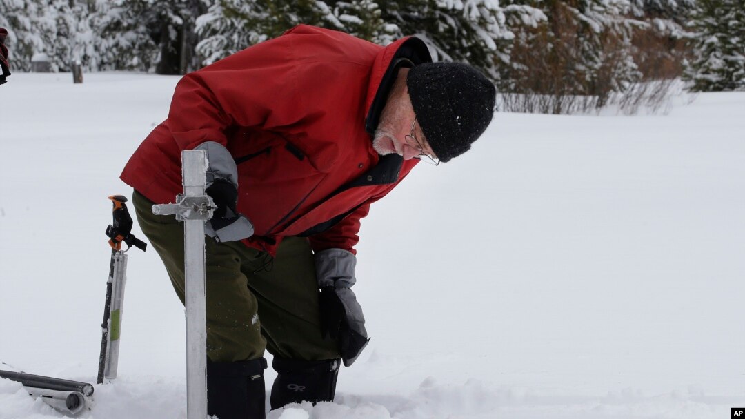  Frank Gehrke, chief of the California Cooperative Snow Surveys Program for the Department of Water Resources, checks the snowpack depth as he conducts the first snow survey of the season at Phillips Station in Echo Summit, California, Jan. 3, 2017.