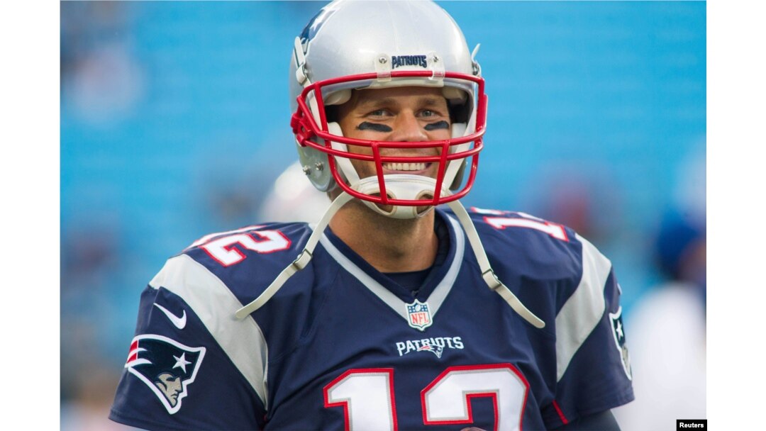 FILE - New England Patriots quarterback Tom Brady (12) stands on the field during warm ups prior to the game against the Carolina Panthers at Bank of America Stadium, Charlotte, North Croloina, Aug 26, 2016.