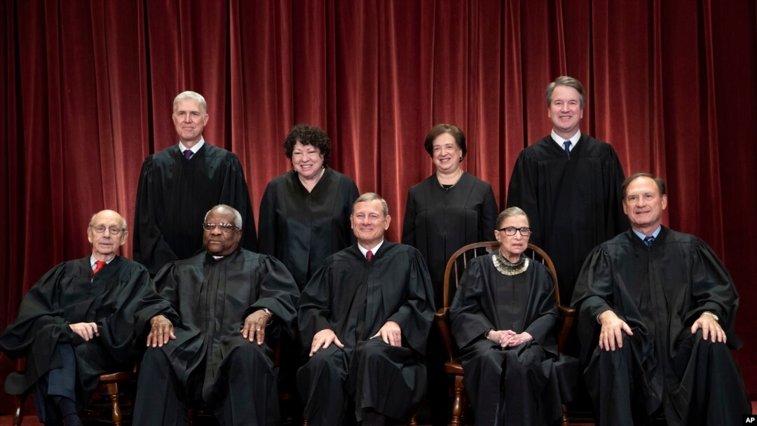 The justices of the U.S. Supreme Court gather for a formal group portrait at the Supreme Court Building in Washington, Nov. 30, 2018.
