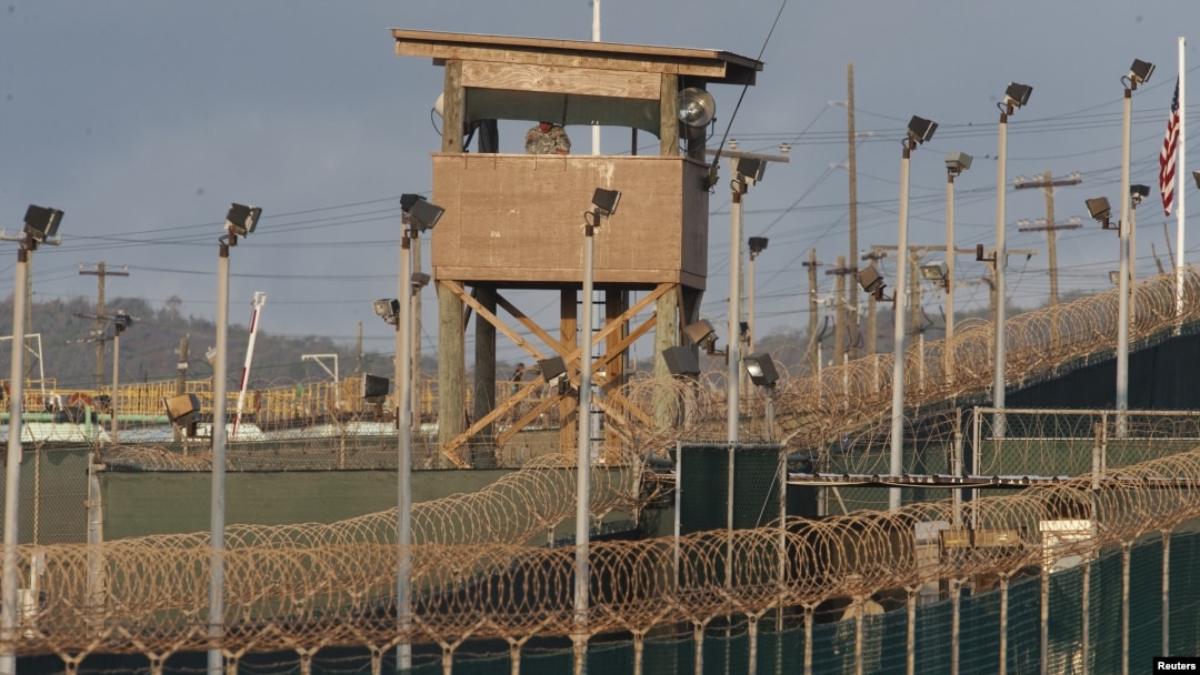 FILE - A US military member mans one of the watch towers at Camp Delta at the US Detention Center in Guantanamo Bay, Cuba. 