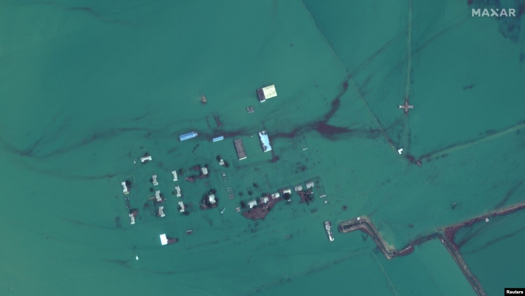 FILE - A satellite image shows flooded homes near the Uzbekistan-Kazakhstan border following the collapse of the Sardoba dam in Uzbekistan, May 3, 2020. 