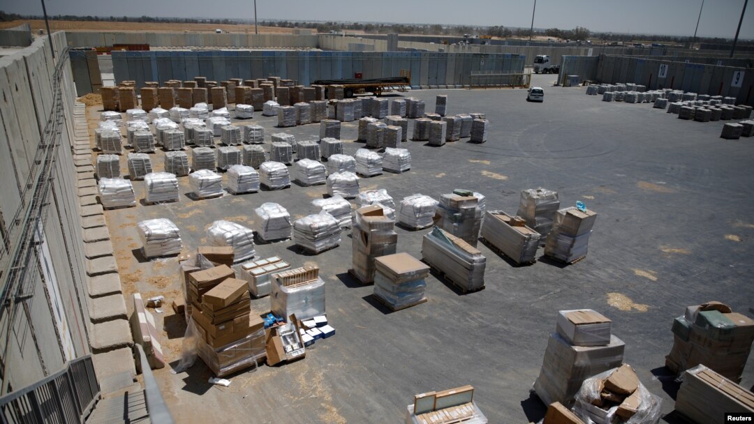 Packages of goods are seen ahead of their transfer to the Gaza Strip, inside the Kerem Shalom border crossing terminal between Israel and Gaza Strip, Israel, Aug. 15, 2018.