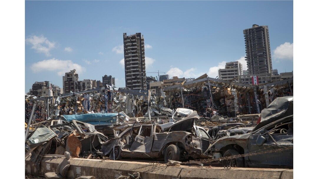 FILE - Damaged cars remain at the site of the Aug. 4 deadly blast in the port of Beirut that killed scores and wounded thousands, in Beirut, Lebanon, Aug. 17, 2020.