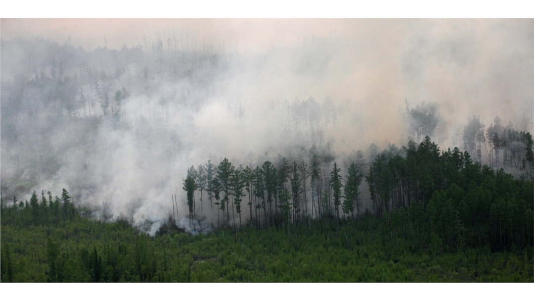 FILE - An aerial view shows the Taiga wood burning near the village of Boguchany, about 560 km (348 miles) northeast of Russia's Siberian city of Krasnoyarsk, June 2, 2011.