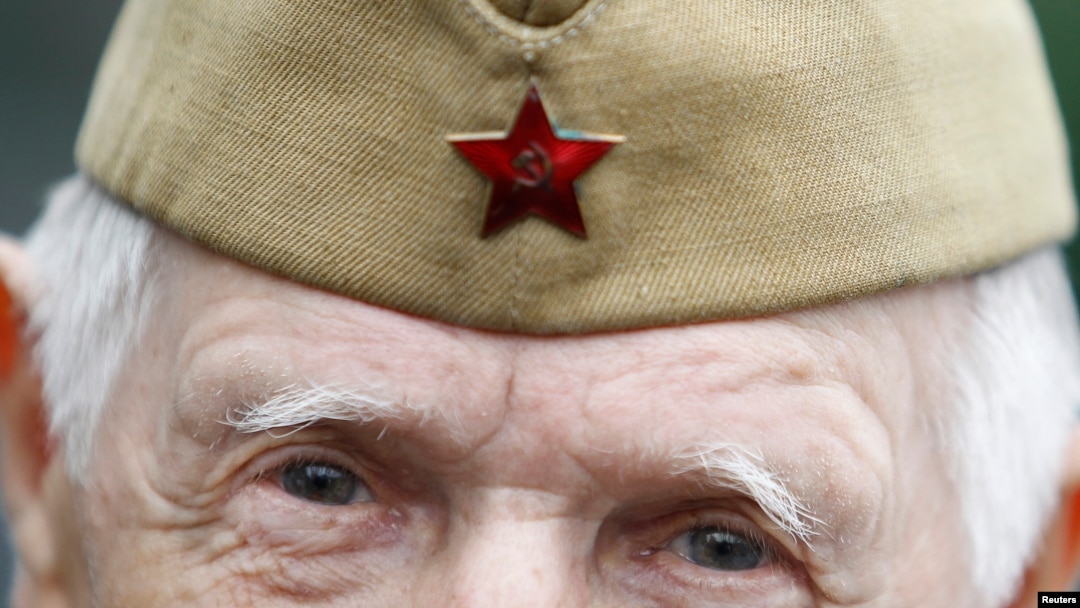 FILE - A World War II veteran looks on during a Victory Day celebration in Gorky Park in Moscow, May 9, 2012. 
