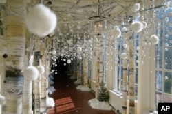 The East Colonnade of the White House is decorated for the holiday season during a press preview of holiday decorations at the White House, Monday, Nov. 28, 2022, in Washington. (AP Photo/Patrick Semansky)