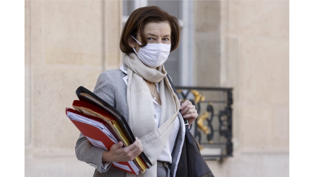 FILE - French Defense Minister Florence Parly, wearing a protective face mask, leaves after a weekly Cabinet meeting at The Elysee Presidential Palace in Paris on March 31, 2021.