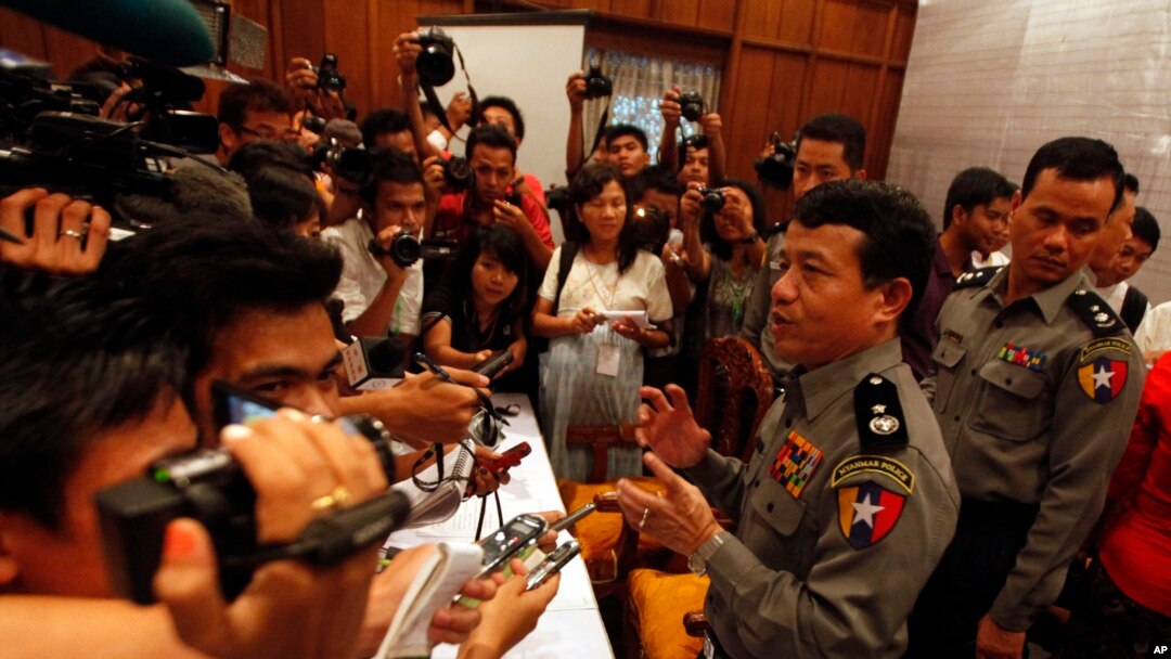Burma's police chief Zaw Win, second from right, talks to journalists during a press conference regarding recent explosions, Oct 18, 2013, at Rangoon Region government office in Rangoon, Burma. 