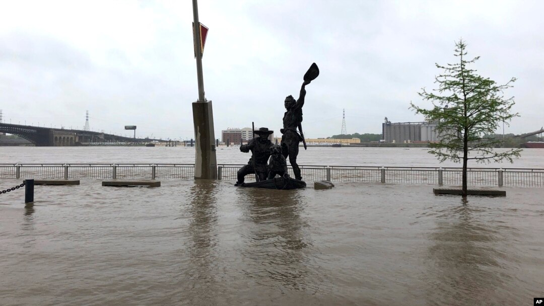 A statue of explorers Lewis and Clark is surrounded by floodwater along the St. Louis riverfront, May 2, 2019. Several Mississippi River towns are seeing floods that are closing in on the historic levels reached in 1993.