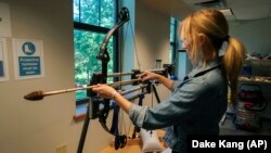 In this June 1, 2017, photo, Michelle Bebber, a PhD archeology student at Kent State University, researched engineering techniques of the first native Americans. (AP Photo/Dake Kang)