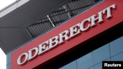FILE - A sign of the Odebrecht SA construction conglomerate is pictured in Lima, Peru, June 28, 2016.