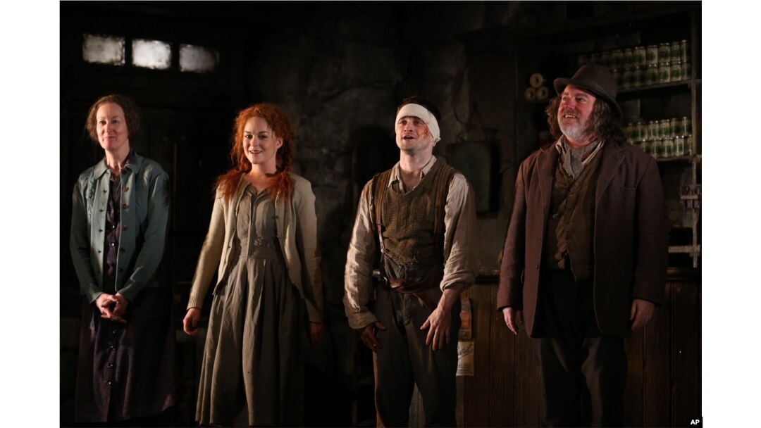 From left, Ingrid Craigie, Sarah Greene, Daniel Radcliffe and Pat Shortt appear at the opening night curtain call of "The Cripple of Inishmaan" on April 20, 2014, in New York.