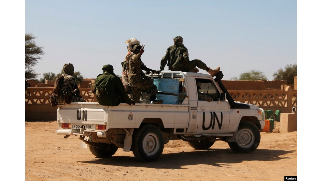 FILE - U.N. peacekeepers patrol in Aguelhok, Mali, Jan. 24, 2014.