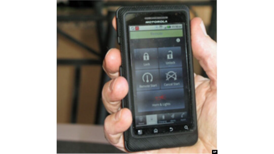 Jeff Parmet starts his Volt inside on a cold day using an application on his mobile phone.