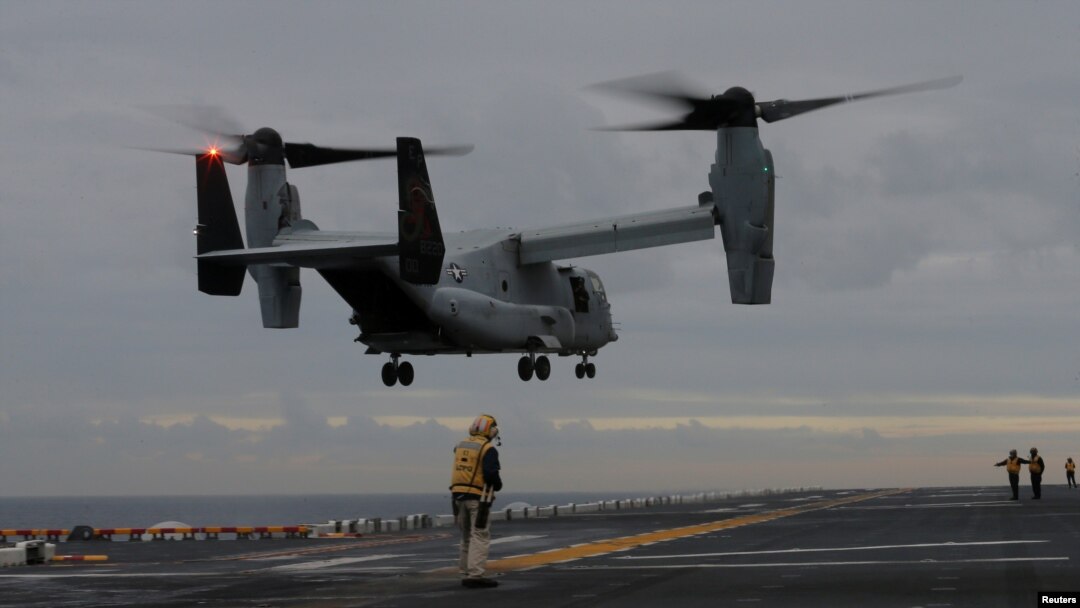 FILE - A U.S. Marines MV-22 Osprey Aircraft lands on the deck of the USS Bonhomme Richard amphibious assault ship off the coast of Sydney, Australia, June 29, 2017. 