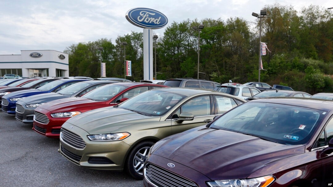 In this Wednesday, May 8, 2013 photo, new 2013 Ford Fusions are seen at an automobile dealer in Zelienople, Pennsylvania. (AP Photo/Keith Srakocic)