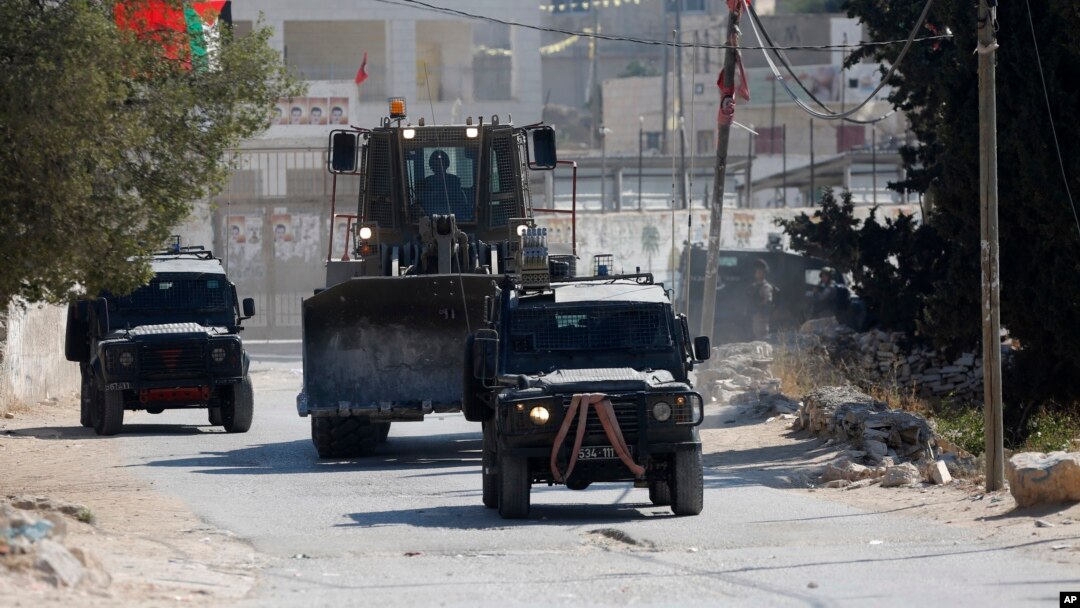 Israeli security forces raid the West Bank village of Deir Abu Mash'al near Ramallah, June 17, 2017, after an attack in Jerusalem killed a police officer.
