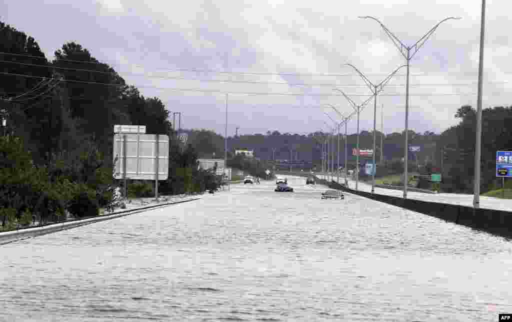 Flooding is seen near Interstate Highway 95 in Lumberton, North Carolina. Hurricane Florence that left up to 13 people dead weakened to a tropical depression, but authorities warned the devastation it caused -- including catastrophic flooding -- is far from over.