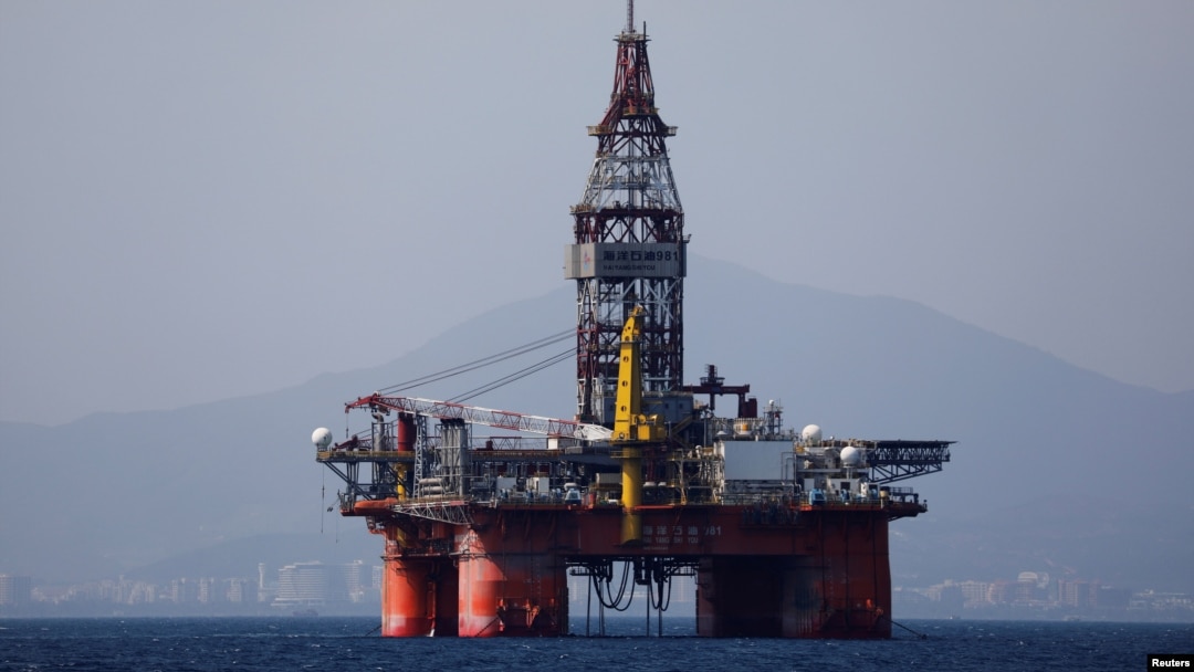 FILE - An oil platform operated by China National Offshore Oil Corporation (CNOOC) is seen in the sea off China's southernmost Hainan province, March 23, 2018.