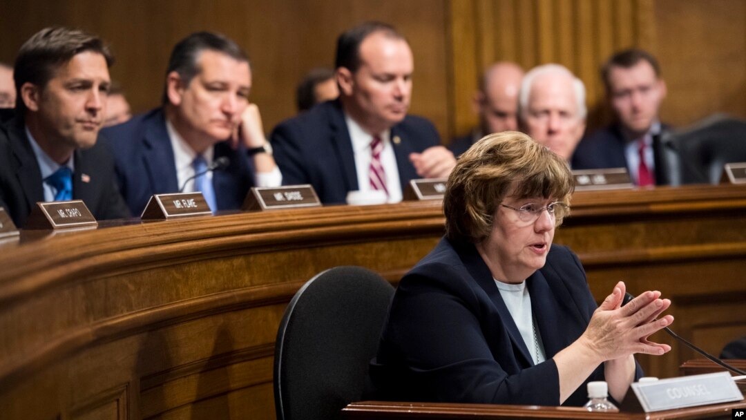 Phoenix prosecutor Rachel Mitchell questions Christine Blasey Ford as, from left, Sen. Ben Sasse, R-Neb., Sen. Ted Cruz, R-Texas, Sen. Mike Lee, R-Utah., and Sen. John Cornyn, R-Texas, listen during the Senate Judiciary Committee hearing, Sept. 27, 2018 on Capitol Hill in Washington.