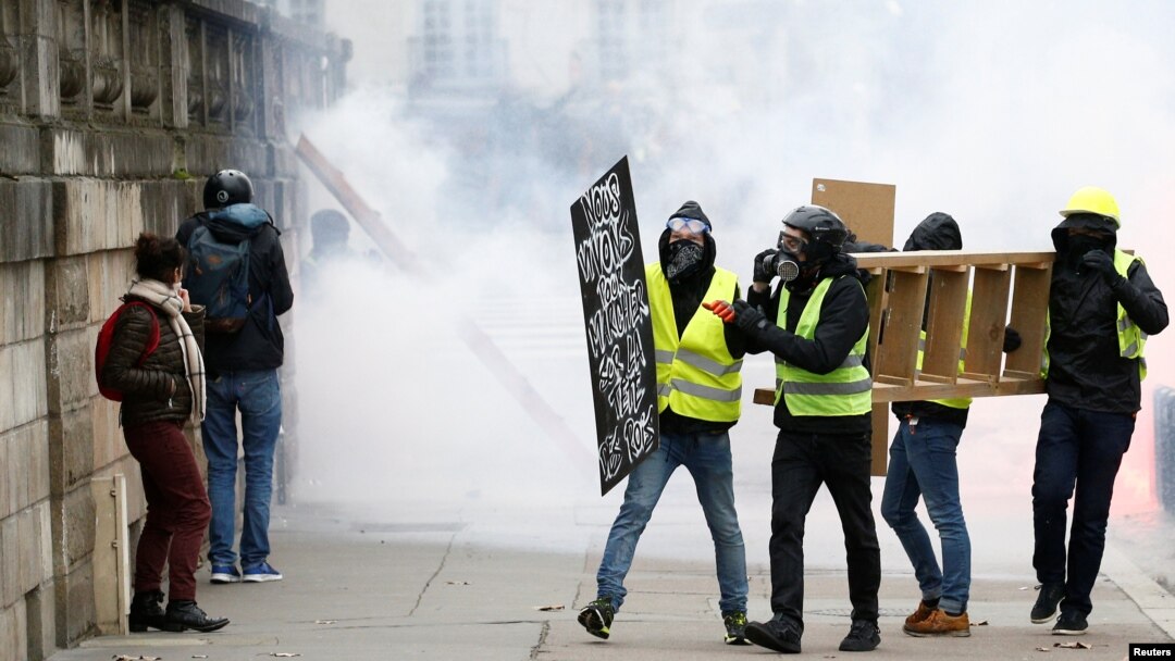 Protesters attend a demonstration of the yellow vest movement in Nantes, France, Jan. 12, 2019.