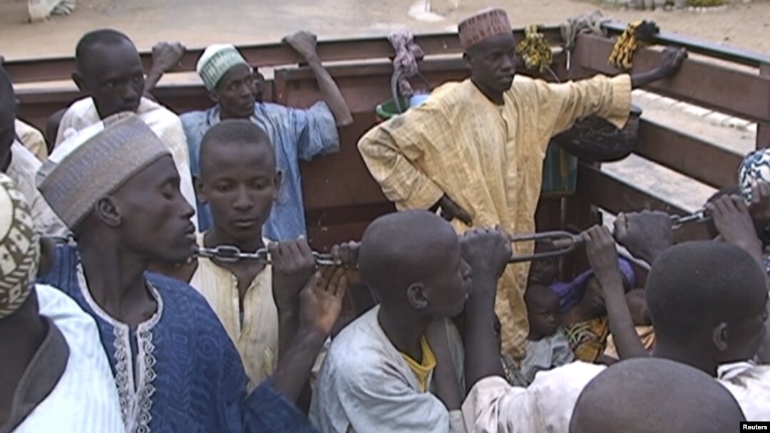 FILE - Former Nigerian hostages held by Boko Haram who were freed by the Cameroonian military arrive in Maroua, Cameroon, Dec. 5, 2015.