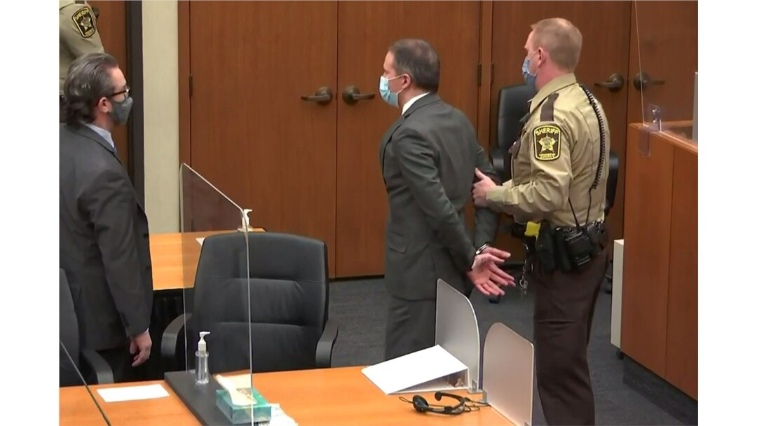 Former Minneapolis police officer Derek Chauvin is led away in handcuffs after a jury found him guilty of all charges in his trial for murder in the death of George Floyd in Minneapolis, April 20, 2021.