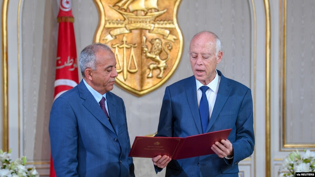 Tunisian President Kais Saied (L) meets with Prime Minister-designate Habib Jemli in Tunis, Tunisia, in this handout picture obtained by Reuters from the Tunisian Presidency, Nov. 15, 2019.