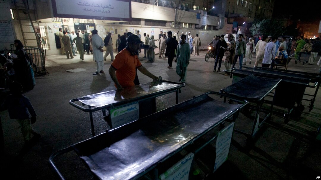 Pakistani hospital staff make arrangements outside an emergency ward for the victims of suicide bombing at a famous shrine in interior Sind province, in Karachi, Pakistan. Thursday, Feb. 16, 2017. 
