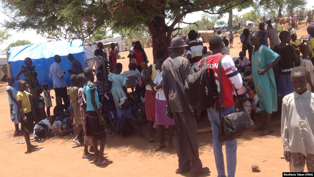 South Sudanese who fled fighting in their country wait in line to be registered as refugees in Uganda in March 2014. Some refugees in Uganda have spoken out against plans by the Juba government to hold elections in June 2015.