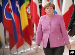 FILE - German Chancellor Angela Merkel arrives for an EU summit at the Europa building in Brussels on Thursday, March 9, 2017.