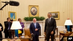 Iraqi Prime Minister Haider Al-Abadi and President Barack Obama after meeting in the Oval Office, Washington, April 14, 2015.