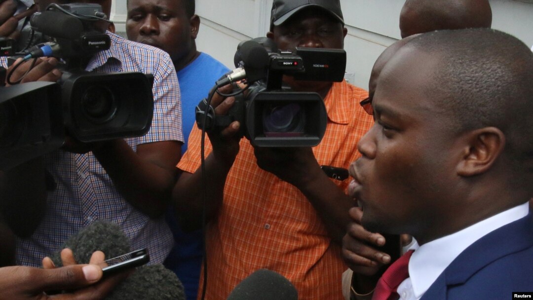Political activist and leader of the Tajamuka/Sesjikile Movement Promise Mkwananzi speaks to the media outside the Constitutional Court in Harare, Zimbabwe, Feb. 8, 2017.