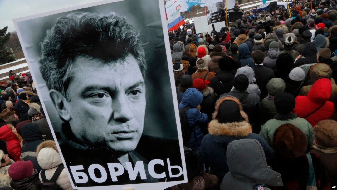 People gather in St. Petersburg, Russia, to commemorate the 2015 slaying of opposition leader Boris Nemtsov, Feb. 27, 2016.