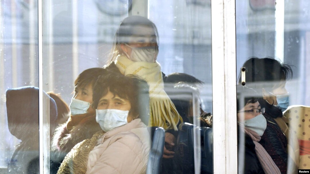 Passengers wear masks inside a trolley bus in Pyongyang, North Korea, Feb. 22, 2020, and released by Kyodo, Feb. 23, 2020.