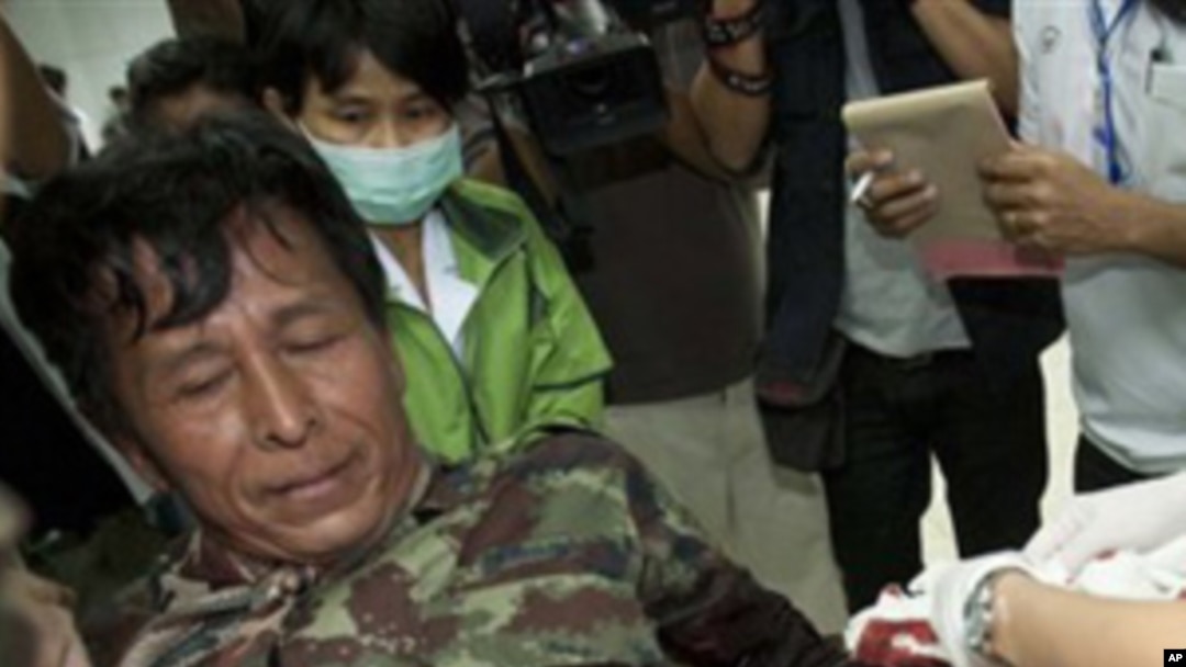 An injured Thai soldier is treated on his arrival at Kantharalak, hospital in Si Sa ket Province, Thailand Sunday, Feb. 6, 2011