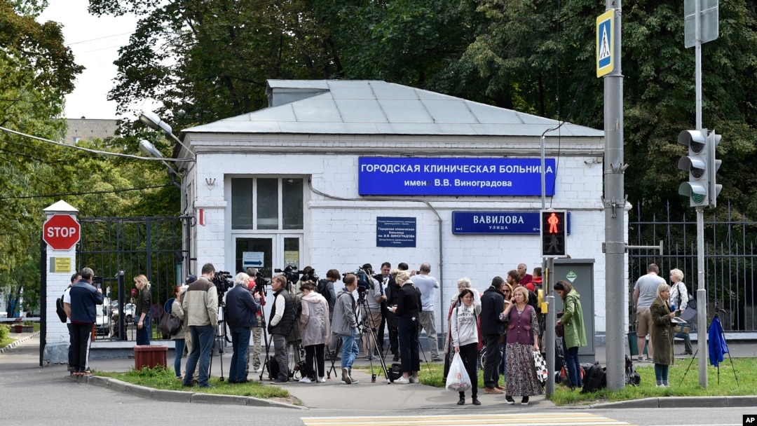 FILE - Journalists gather at a hospital where Russian opposition leader Alexei Navalny had been hospitalized, in Moscow, July 29, 2019. 
