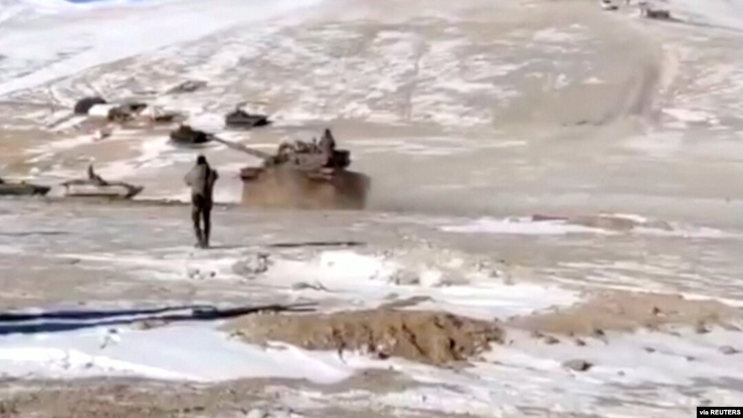 FILE - A screenshot from video shows the disengagement process between the Indian Army and China's People's Liberation Army from a contested lake area in the western Himalayas, in Ladakh region, India, Feb. 11, 2021. (Indian Army/Reuters TV/via Reuters)