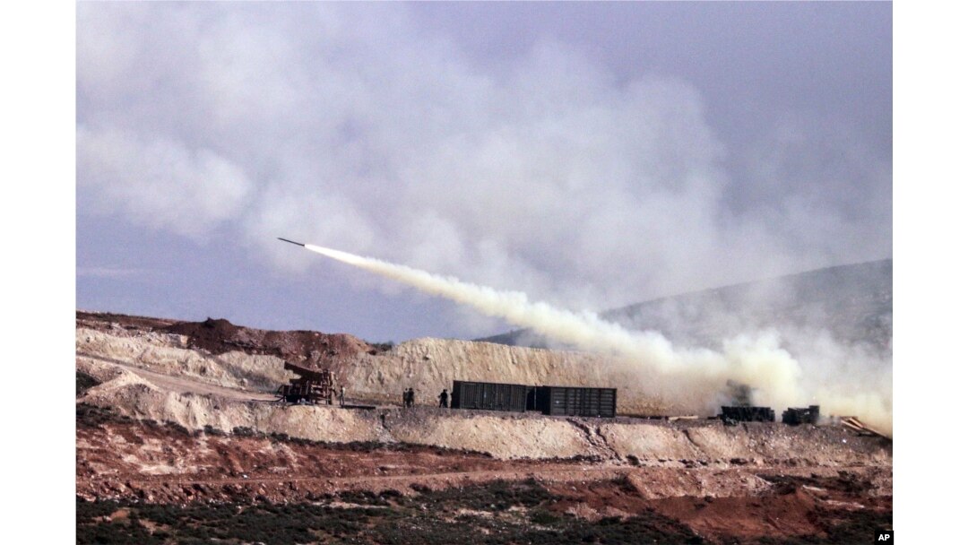 Turkish artillery fires toward Syrian Kurdish positions in Afrin area, Syria, from Turkish side of the border in Hatay, Turkey, Feb. 9, 2018.