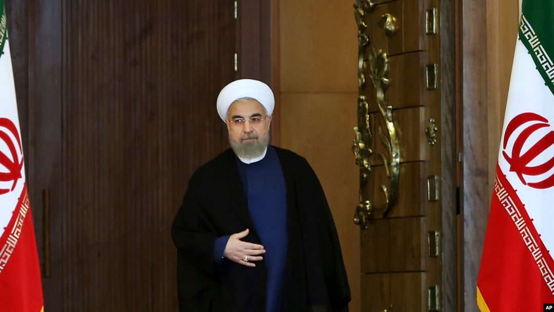 FILE - Iran's President Hassan Rouhani arrives for an address to the nation after a nuclear agreement was announced in Vienna, in Tehran, Iran, July 14, 2015.
